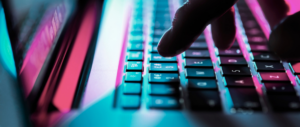 Close up of person typing on keyboard