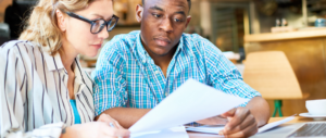 Man and women looking through banking statements