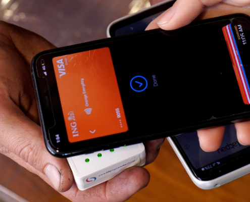 Using a mobile to make a payment on Latpay's all-in-one terminal